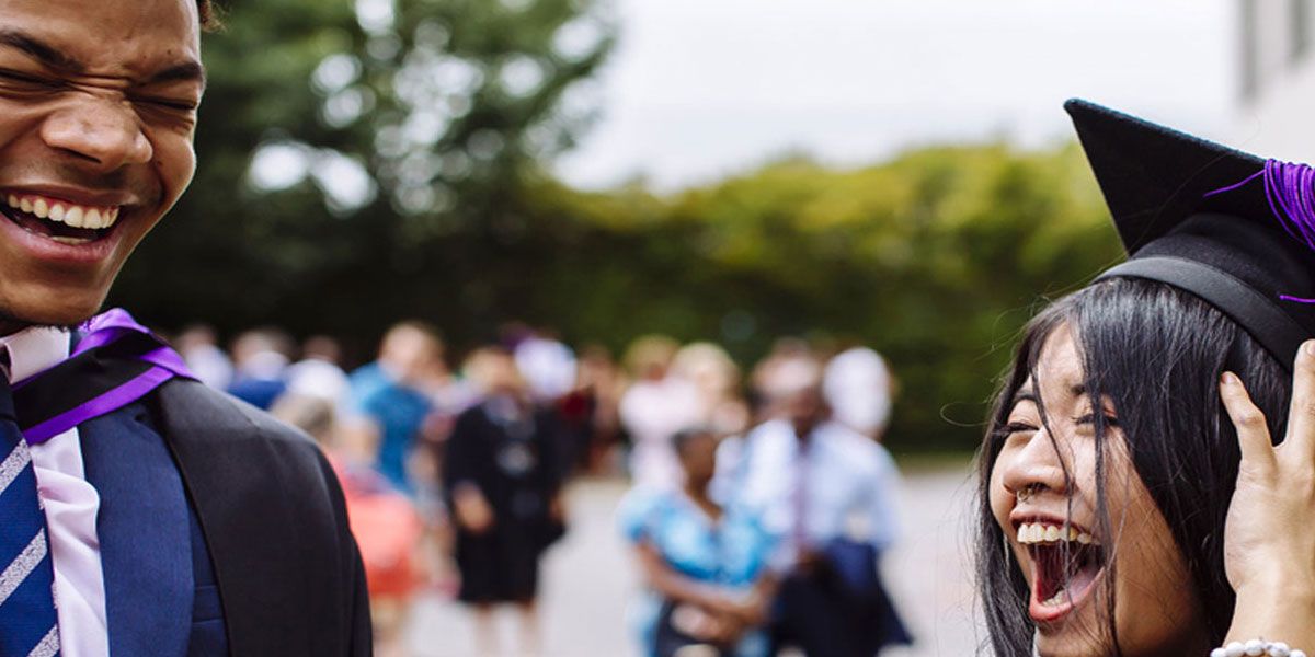 Two students at graduation