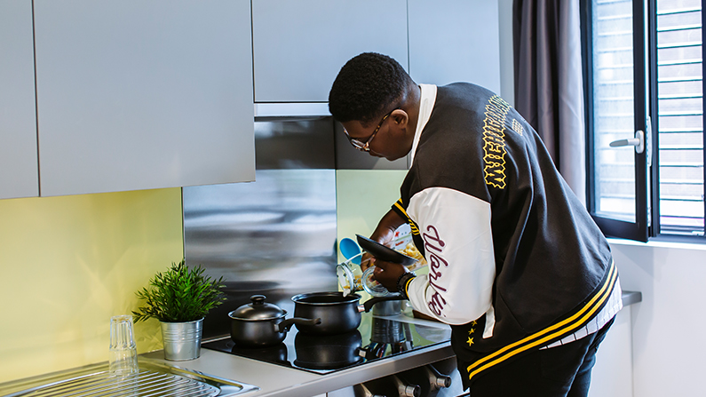 Student cooking in halls