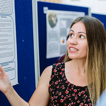Female student looking on notice board