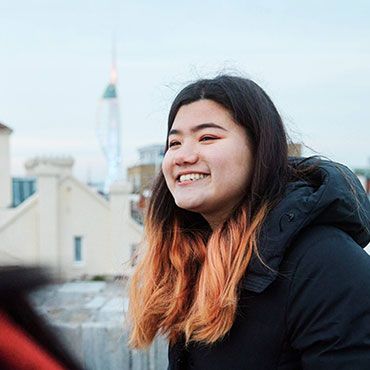 Female student exploring Portsmouth and Spinnaker Tower