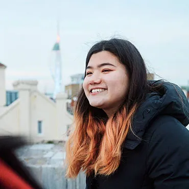 Female student exploring Portsmouth and Spinnaker Tower