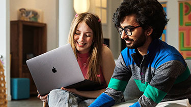 Male and female students studying together