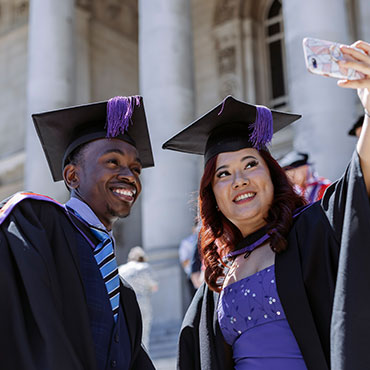 Students graduating and taking a selfie photo
