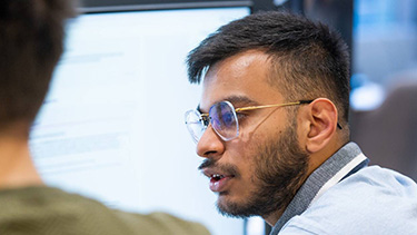 Student watching on the desktop in the classroom