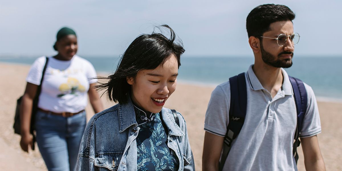 Students walking on Portsmouth beach