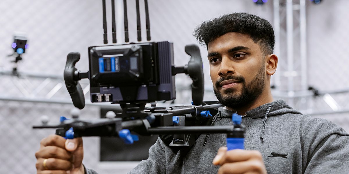 Male student using technical equipment