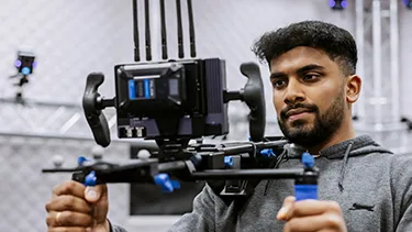 Male student using technical equipment